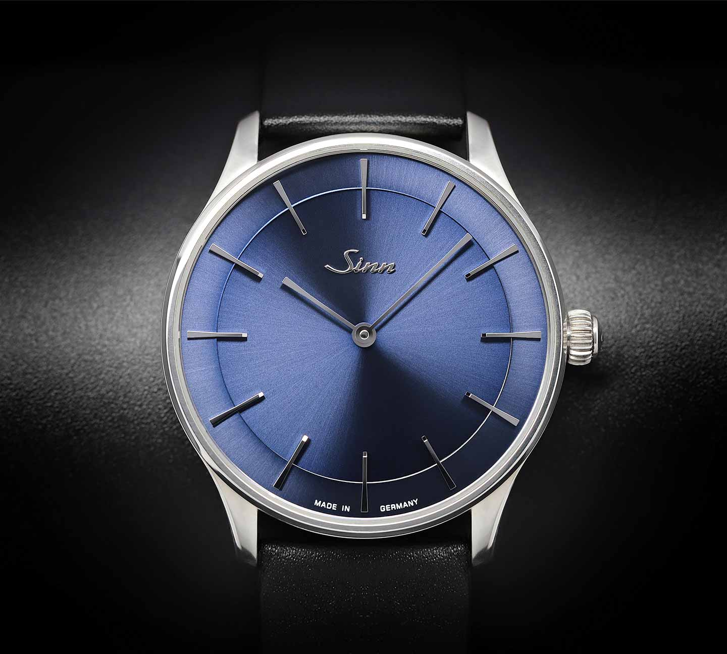 Sinn 1739 Ag B with blue dial and black leather strap on a black background.
