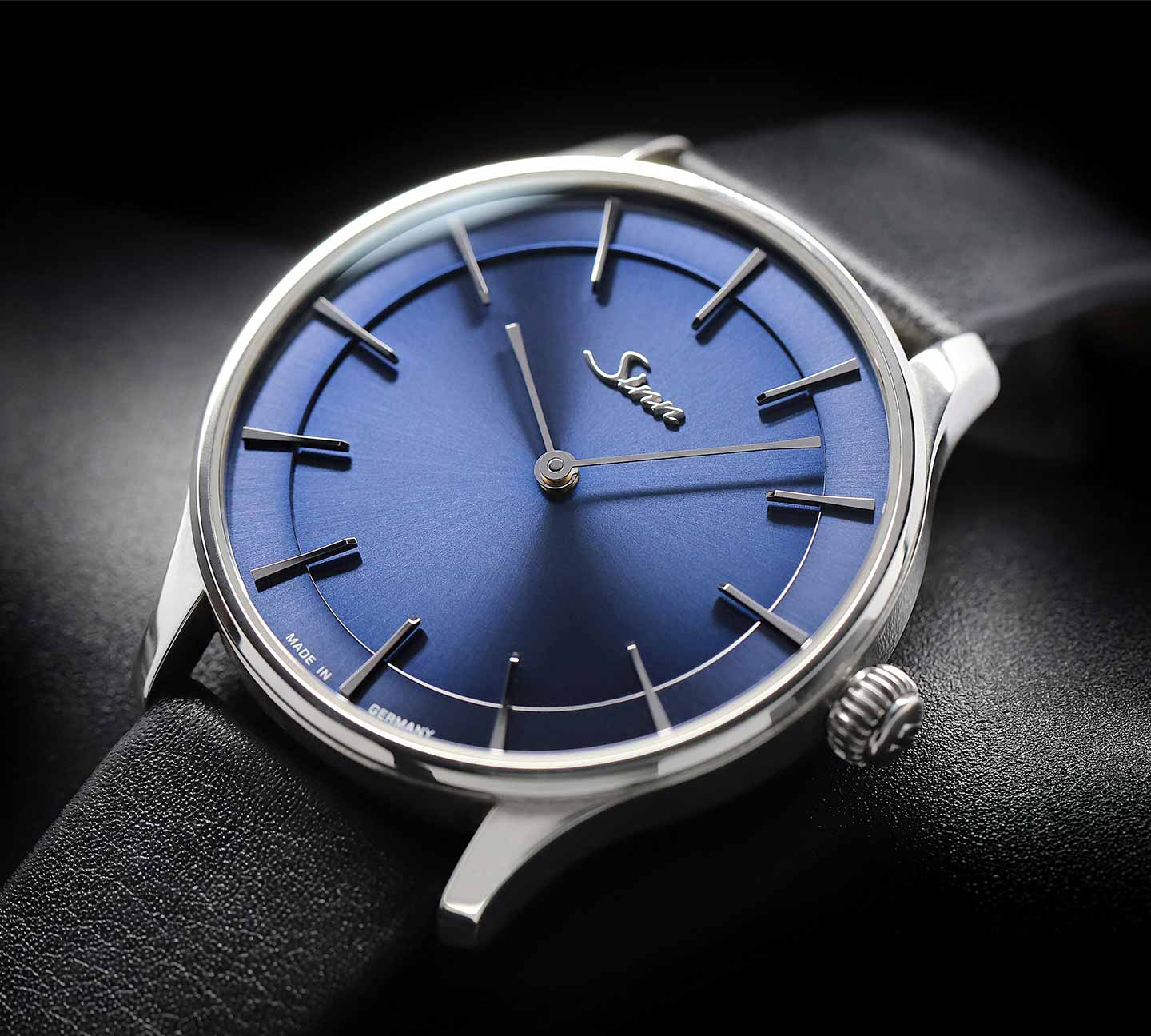 Sinn 1739 Ag B with blue sunburst dial and black leather strap in close-up.