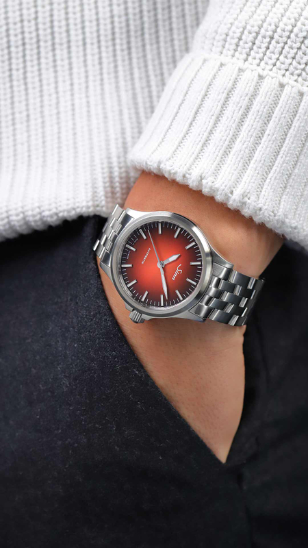 Sinn 556 I worn on the wrist with a beige leather strap.