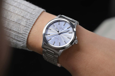 The 556 with an ice-blue dial on a woman's wrist