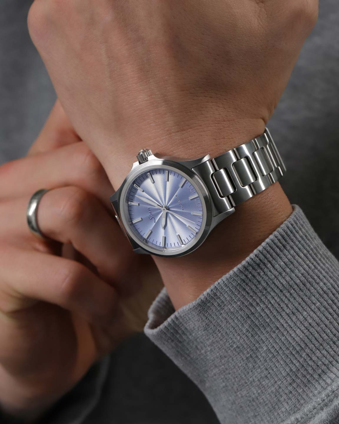 The 556 with an ice-blue dial on a man's wrist