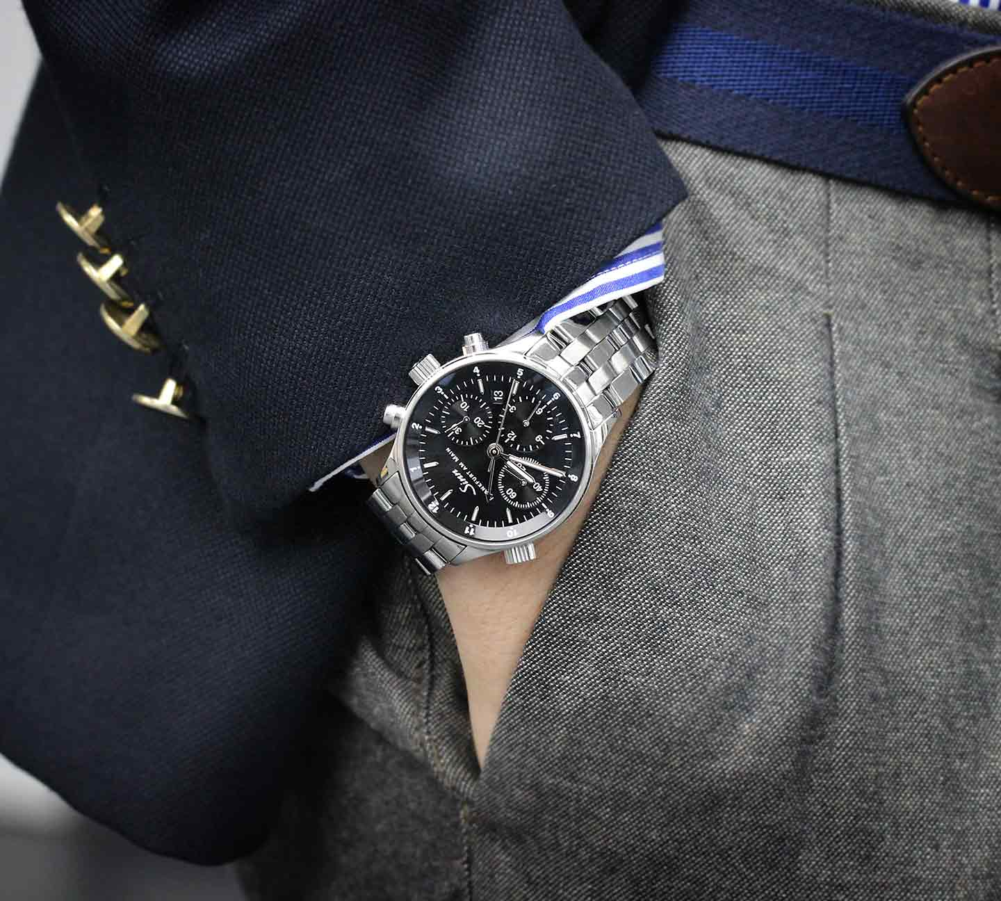 Sinn 6000 worn on the wrist with business attire.
