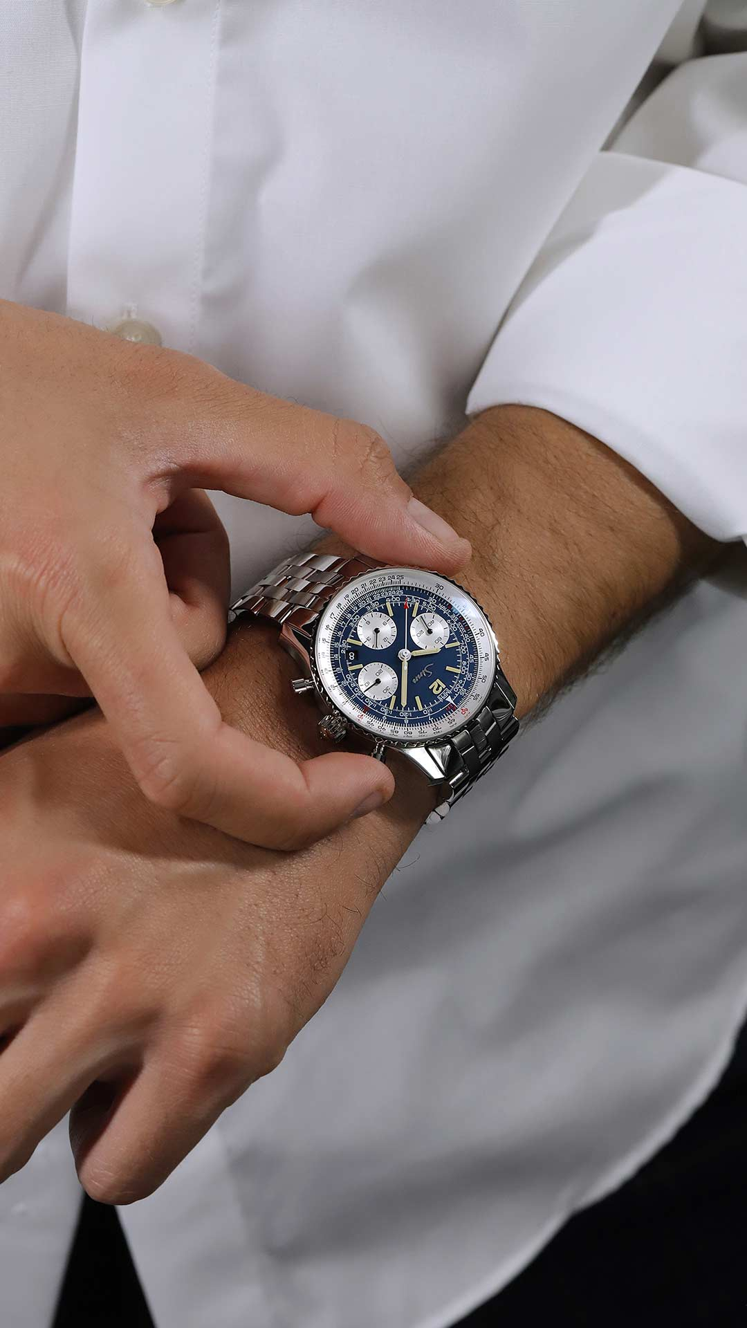 Sinn 903 St BE II on the wrist with stainless steel bracelet.
