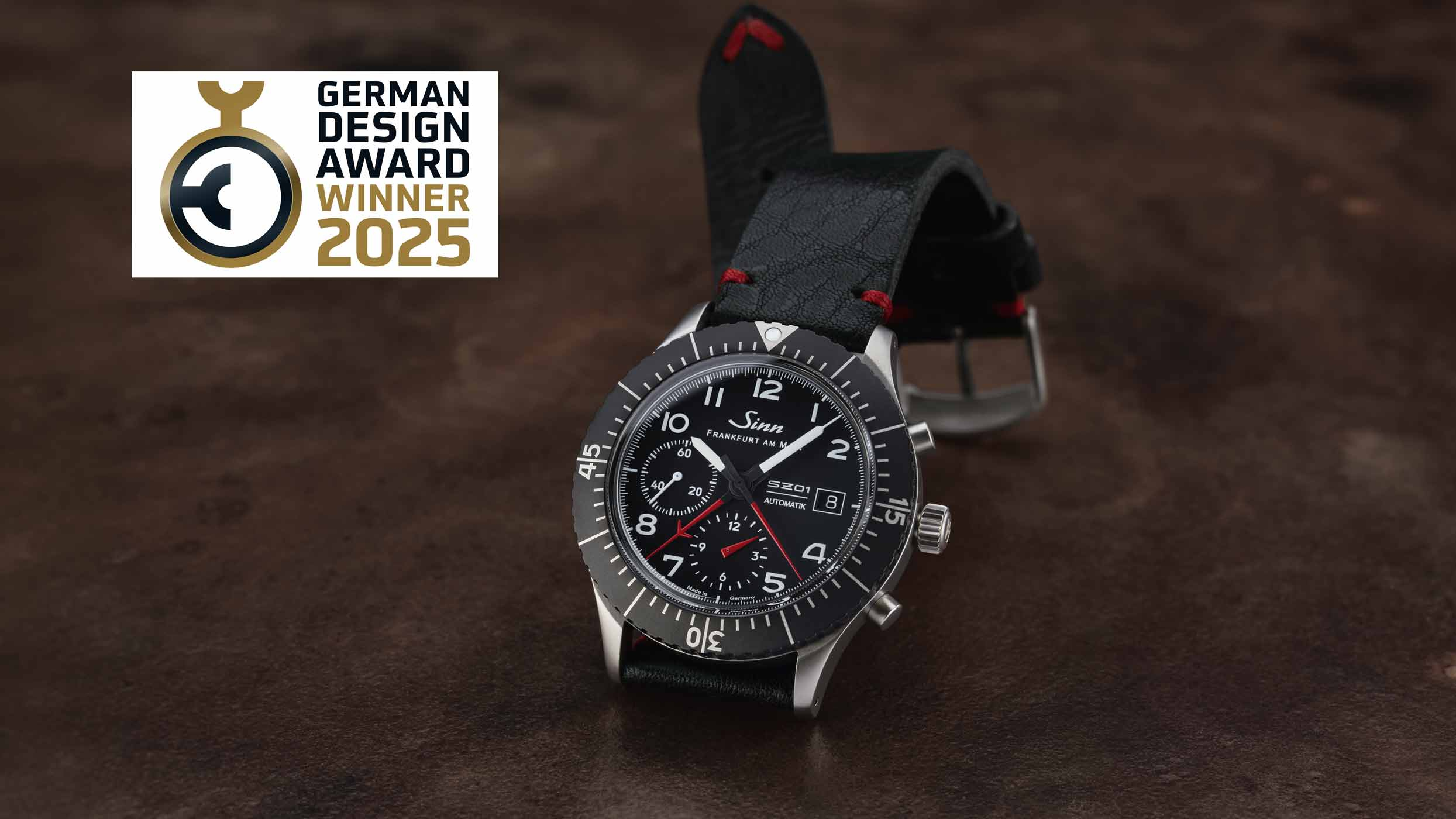 Sinn chronograph with black leather strap and sporty dial, winner of the German Design Award 2025.