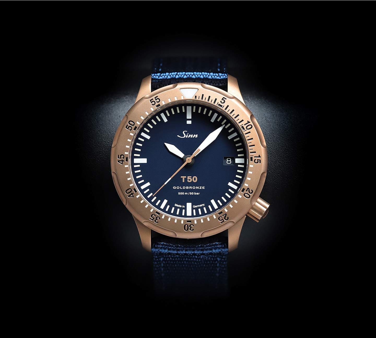 Sinn T50 GOLDBRONZE B with blue dial and gold bronze case, photographed from the front.